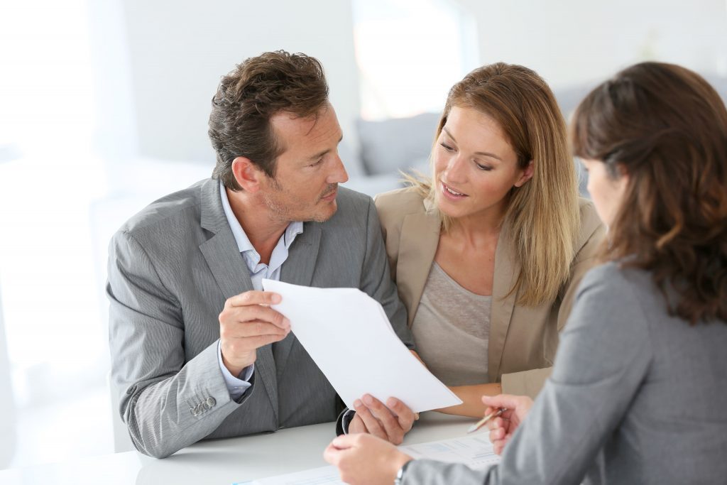 couple looking at their real estate portfolio