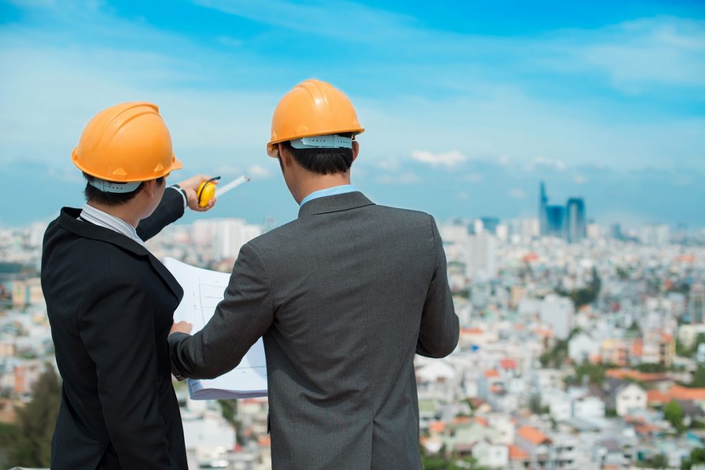 Businessmen in hard hats