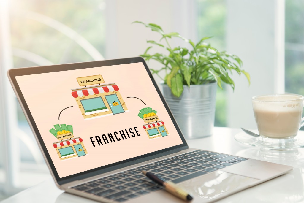 Franchising concept shown in laptop monitor