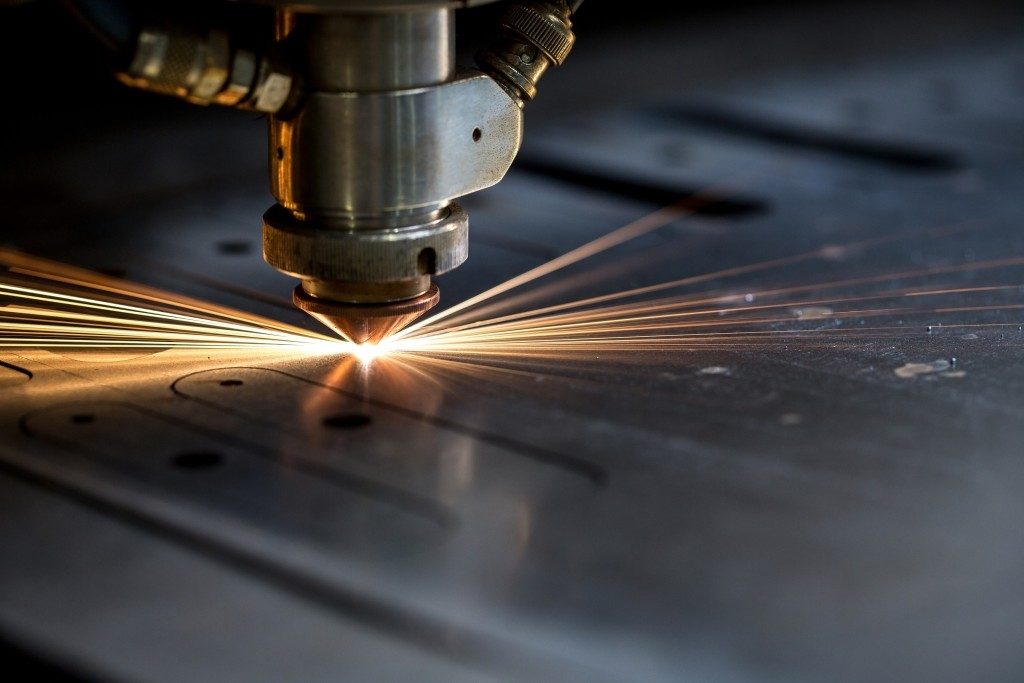 sparks fly from laser
