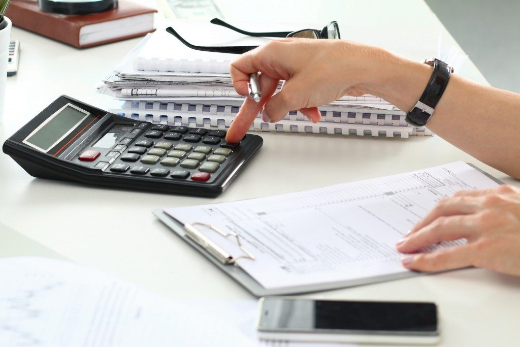 accountant or banker making calculations